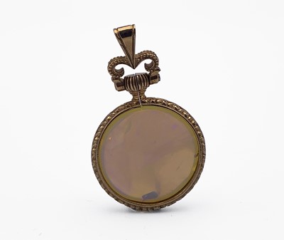 Lot 383 - An unmarked gold opal pendant Diameter 24.4mm...