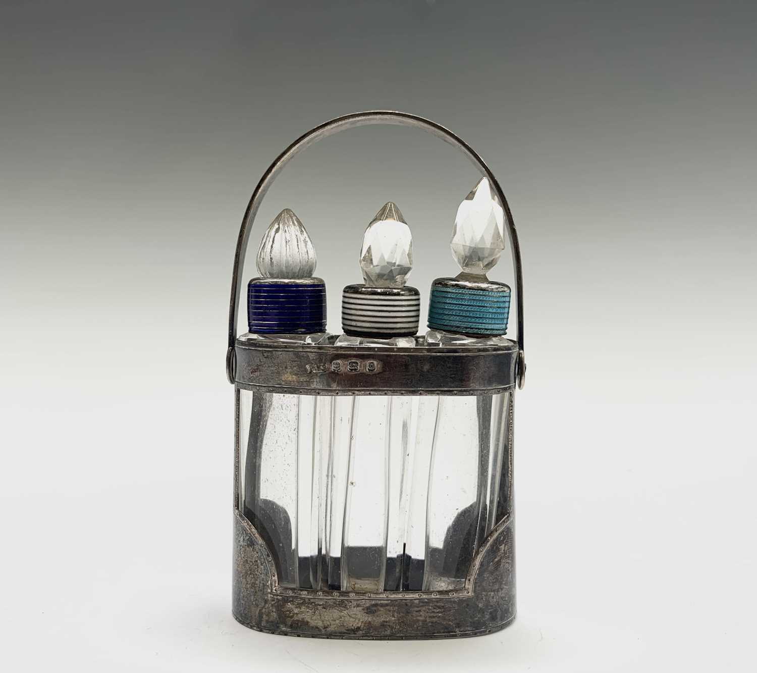 Lot 1065 - An early George VI perfume set with three cut...