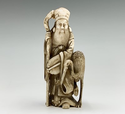 Lot 34 - A Chinese carved ivory figure of Shouxing,...