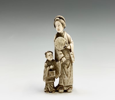 Lot 342 - A Chinese carved ivory group of a mother and...