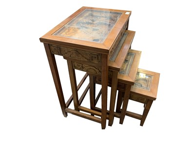 Lot 282 - A nest of four Chinese hardwood occasional...