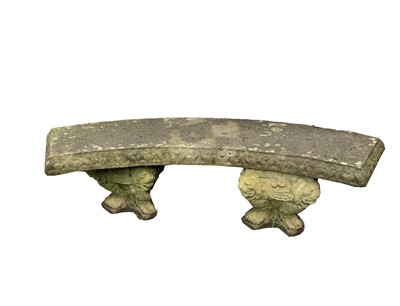 Lot 625 - A composition stone garden bench, the curved...