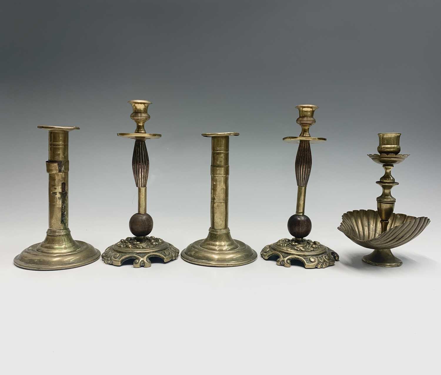 Lot 381 - A pair of 19th century brass candlesticks,...