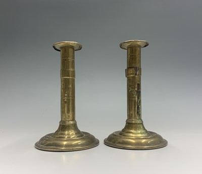 Lot 381 - A pair of 19th century brass candlesticks,...