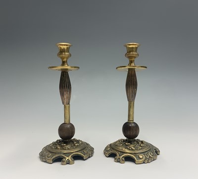 Lot 381 - A pair of 19th century brass candlesticks,...