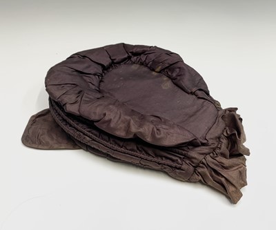 Lot 2809 - A late 18th century brown silk Calash bonnet,...