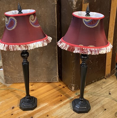 Lot 19 - A handsome pair of ebonized lamps, with...
