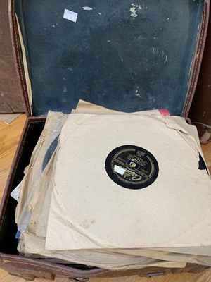 Lot 42 - 78 rpm records in an overflowing suitcase