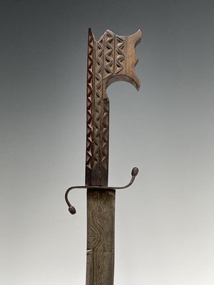 Lot 1033 - A Middle Eastern sword, 19th century, with...