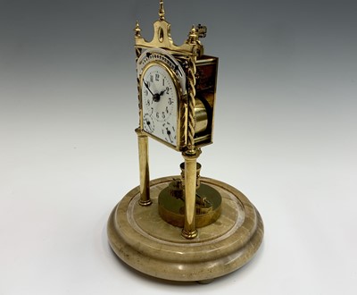 Lot 2919 - A rare German brass 400 day calendar torsion...