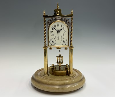 Lot 2919 - A rare German brass 400 day calendar torsion...