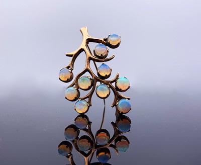 Lot 167 - A 9ct gold tree brooch set with ten opals...