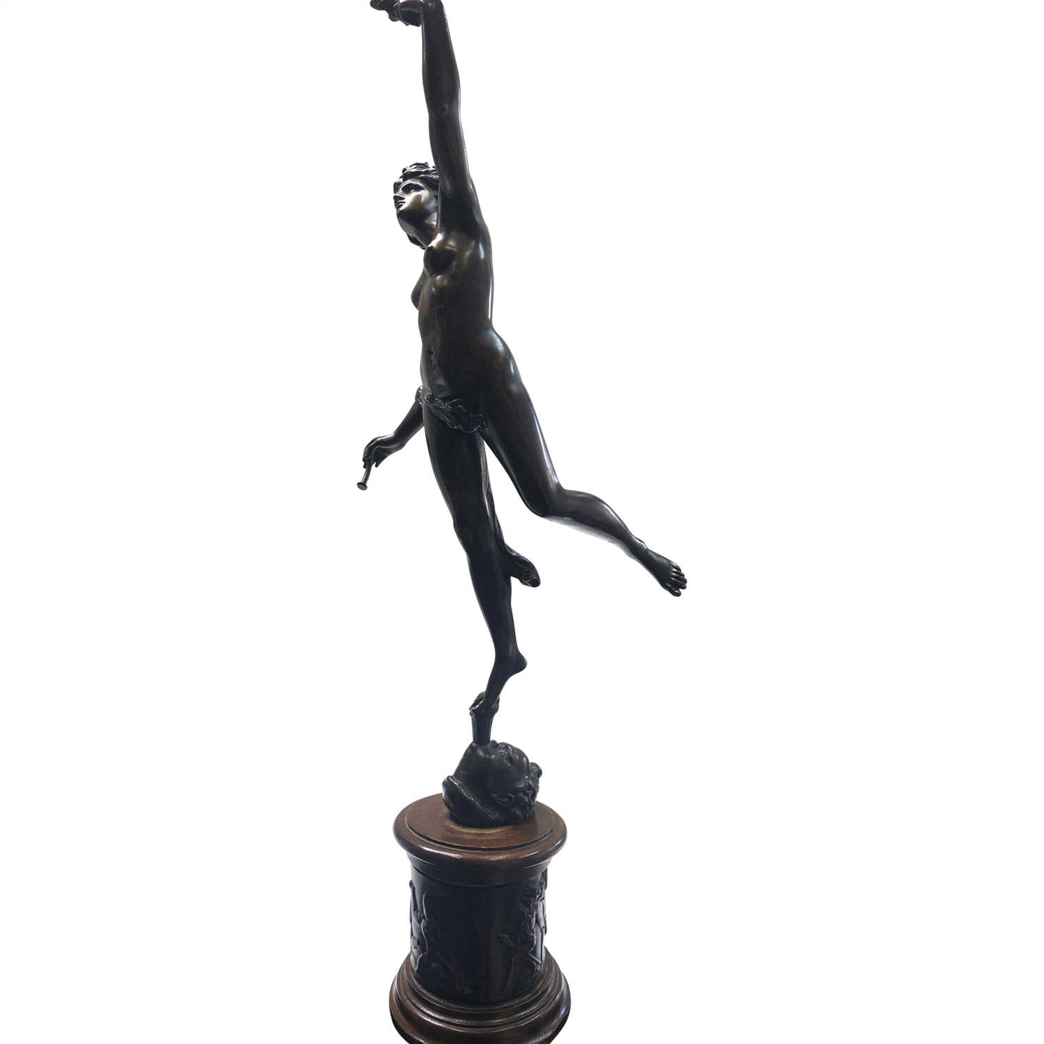 Lot 12 - A bronzed classical female figure holding fig...