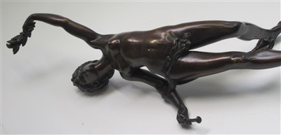 Lot 12 - A bronzed classical female figure holding fig...