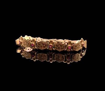 Lot 394 - A 9ct rose gold bracelet with hexagon clover...