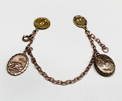 Lot 54 - A 9ct chain bracelet with three fobs (one gold?...
