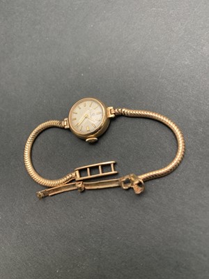 Lot 354 - A Cyma Ladies gold wristwatch with snake link...