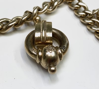 Lot 232 - A silver gilt curb link bracelet with three...