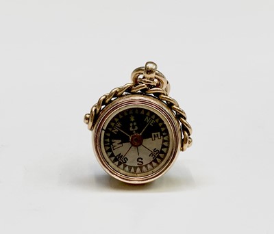 Lot 438 - An Edwardian 15ct gold compass fob with mother-...