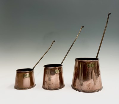 Lot 409 - A set of three graduated Wigorn Crafts copper...