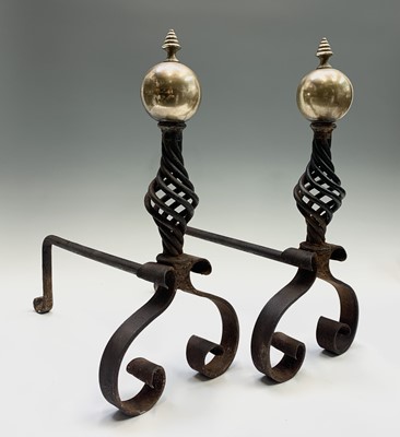 Lot 427 - A pair of wrought iron and brass andirons,...