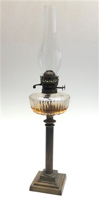 Lot 102 - A late 19th/early 20th century oil lamp with...