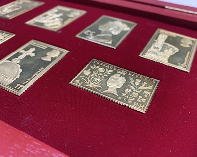 Lot 1030 - A set of seven silver-gilt replica stamps-...