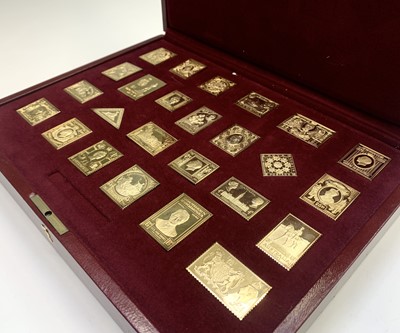 Lot 1016 - A set of 25 silver gilt replica stamps.