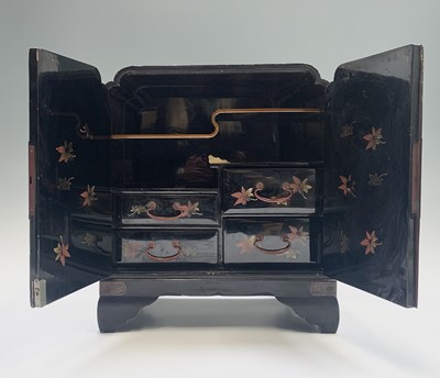 Lot 40 - A Japanese gilt and black lacquered table...