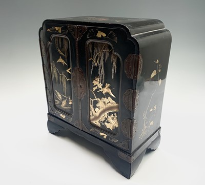 Lot 40 - A Japanese gilt and black lacquered table...