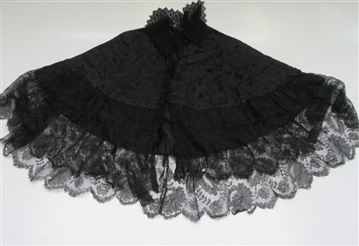 Lot 108 - A Victorian black silk and lace cape, length...