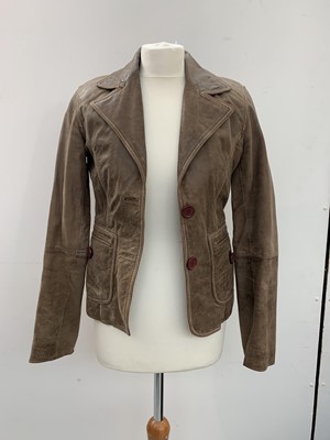 Lot 2860 - An olive green suede jacket together with a...