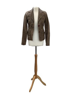 Lot 2860 - An olive green suede jacket together with a...