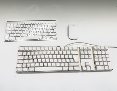 Lot 458 - Two Apple iMac computers, both with a keyboard,...