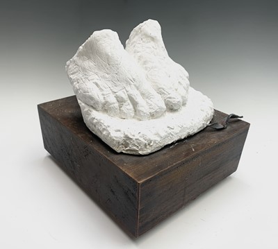 Lot 581 - A pair of cast plaster feet, mounted in the...