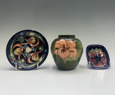 Lot 821 - A Moorcroft hibiscus pattern small tube lined...