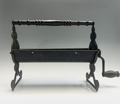 Lot 463 - A vintage cast iron and metal newspaper log...