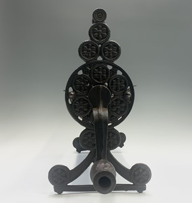 Lot 463 - A vintage cast iron and metal newspaper log...