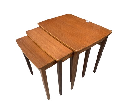 Lot 3288 - A nest of three retro teak occasional tables...