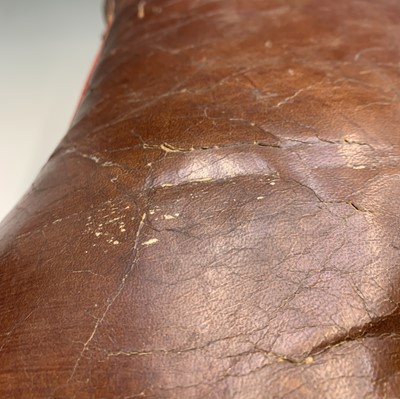 Lot 3290 - A leather topped camel saddle style footstool....