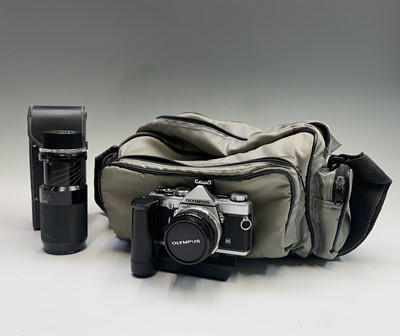 Lot 456 - An Olympus OM-1 SLR camera with motor winder 2...