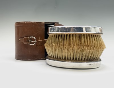 Lot 1050 - A pair of silver-mounted gentleman's brushes...