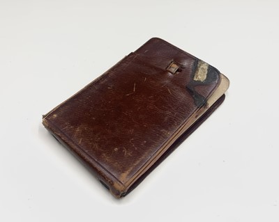 Lot 487 - An American brown leather pocket sketchbook,...