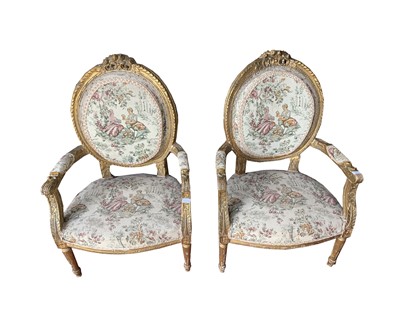 Lot 3136 - A pair of French giltwood and gesso armchairs,...