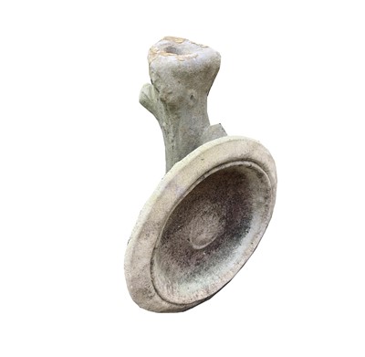 Lot 618 - A reconstituted stone bird bath on cast tree...