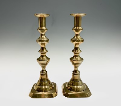 Lot 599 - A pair of Victorian brass candlesticks with...