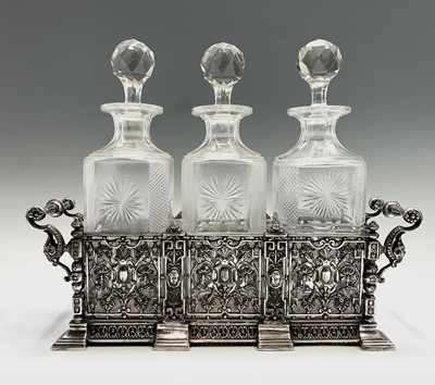 Lot 553 - A 19th century silver plated three bottle...