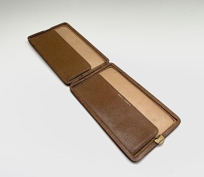 Lot 220 - A Dunhill leather cigarette case, width 16cm,...