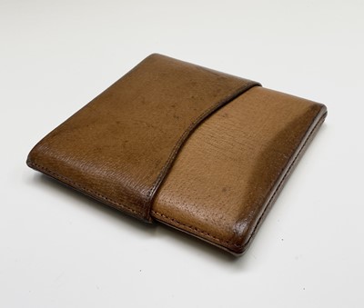 Lot 220 - A Dunhill leather cigarette case, width 16cm,...