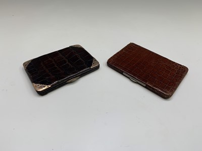 Lot 548 - A crocodile wallet with 9ct gold corners,...